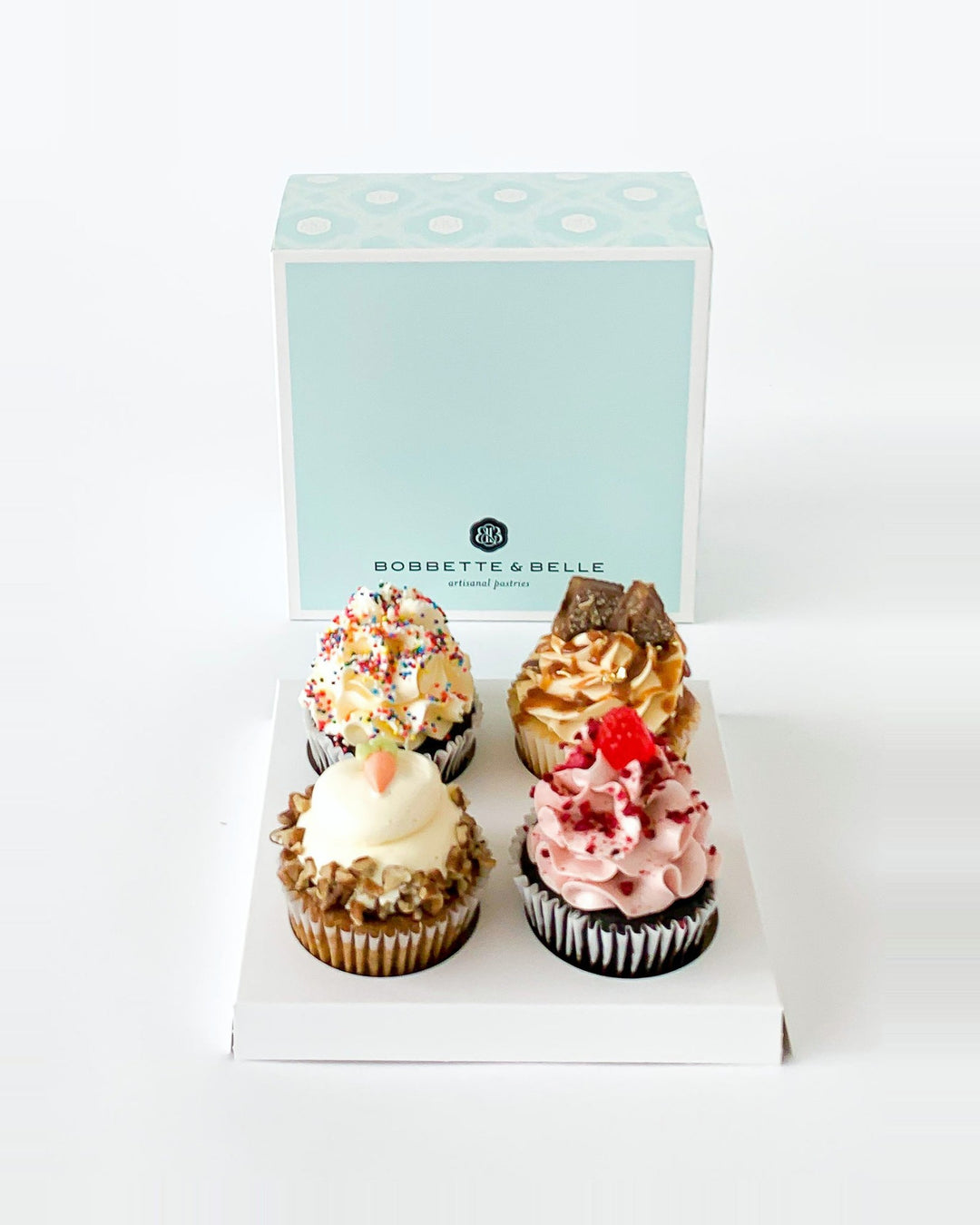 4 assorted cupcakes in a Bobbette & Belle box