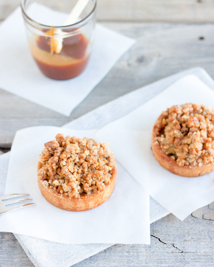 Individual apple crumble tart with spiced apples and buttery streusel