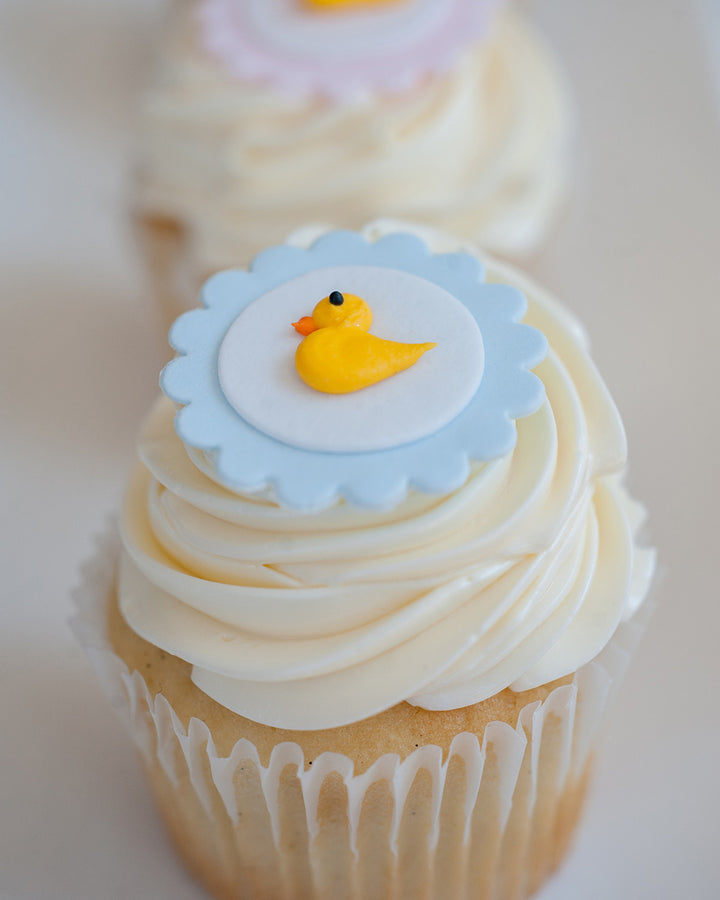 Baby Duckie Cupcake Favour by Bobbette & Belle, a cupcake topped with a sugar duck