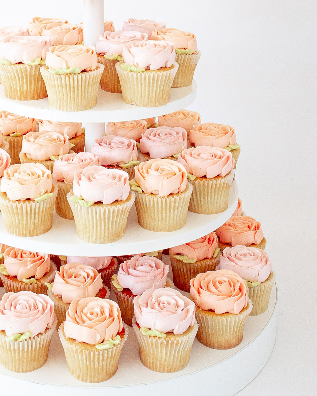 Buttercream rose cupcake tower with pink piped roses, by Bobbette & Belle Toronto