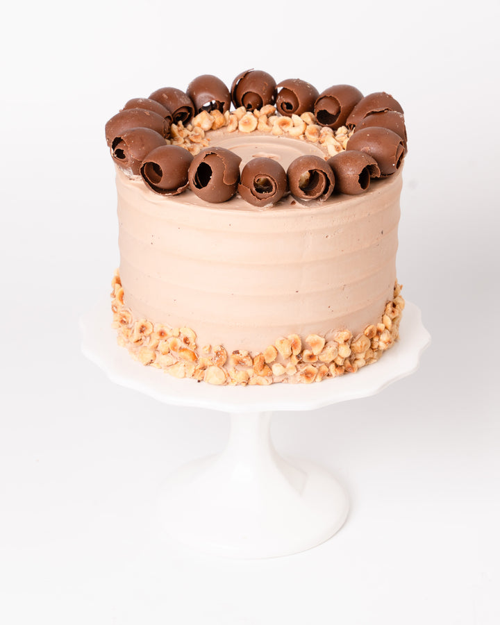 Chocolate hazelnut cake with Gianduja ganache and hazelnut chocolate curls, by Bobbette & Belle