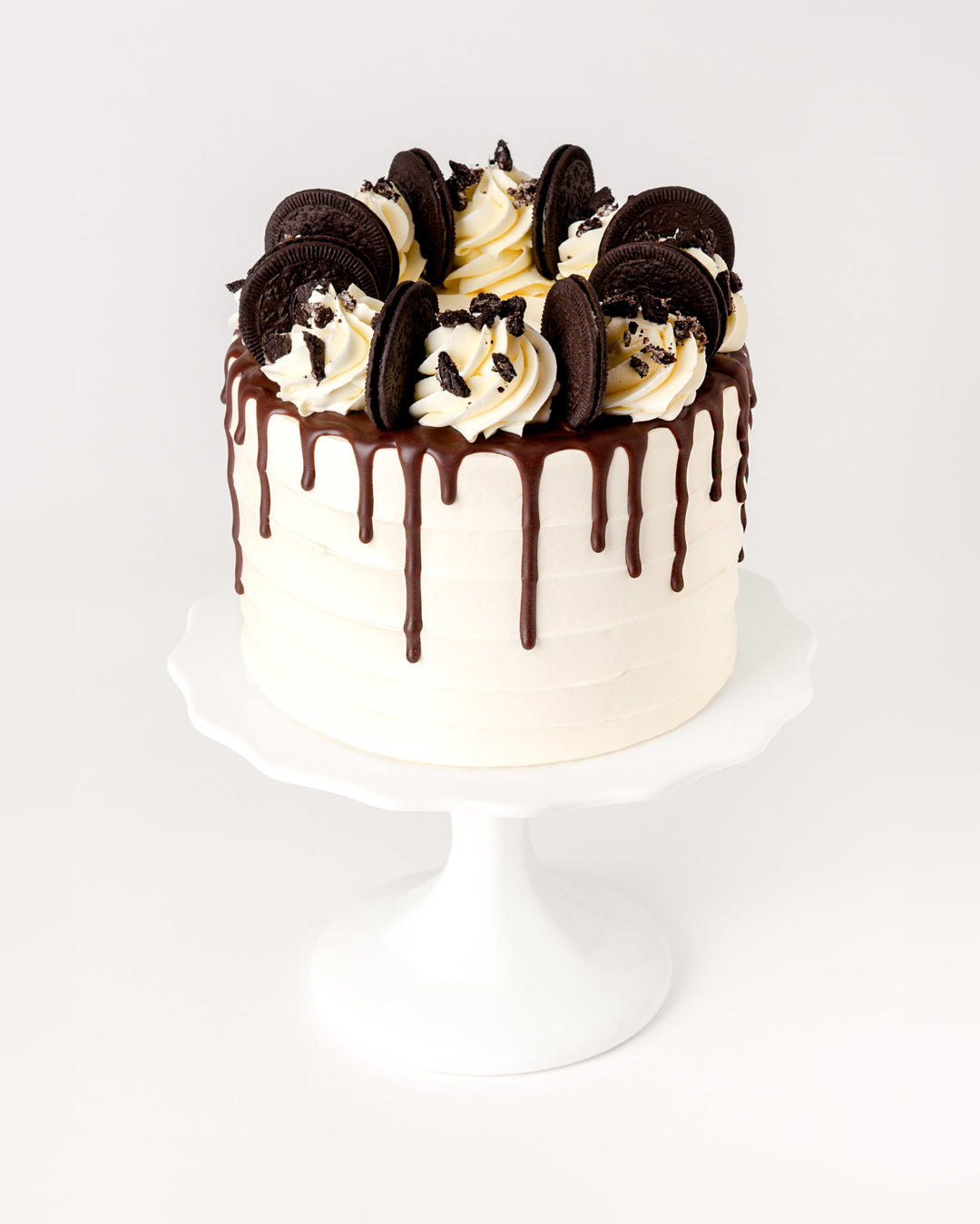 Cookies and cream cake with Oreos, vanilla buttercream and chocolate ganache drip