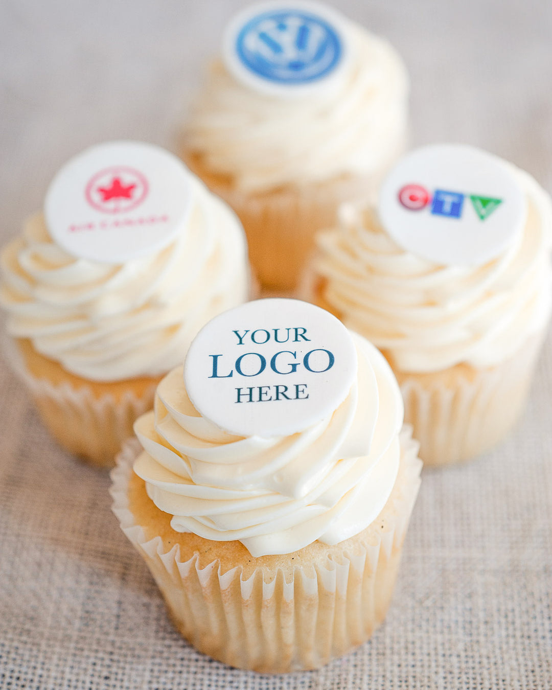 Cupcakes topped with custom edible image logos for corporate events, by Bobbette & Belle Toronto