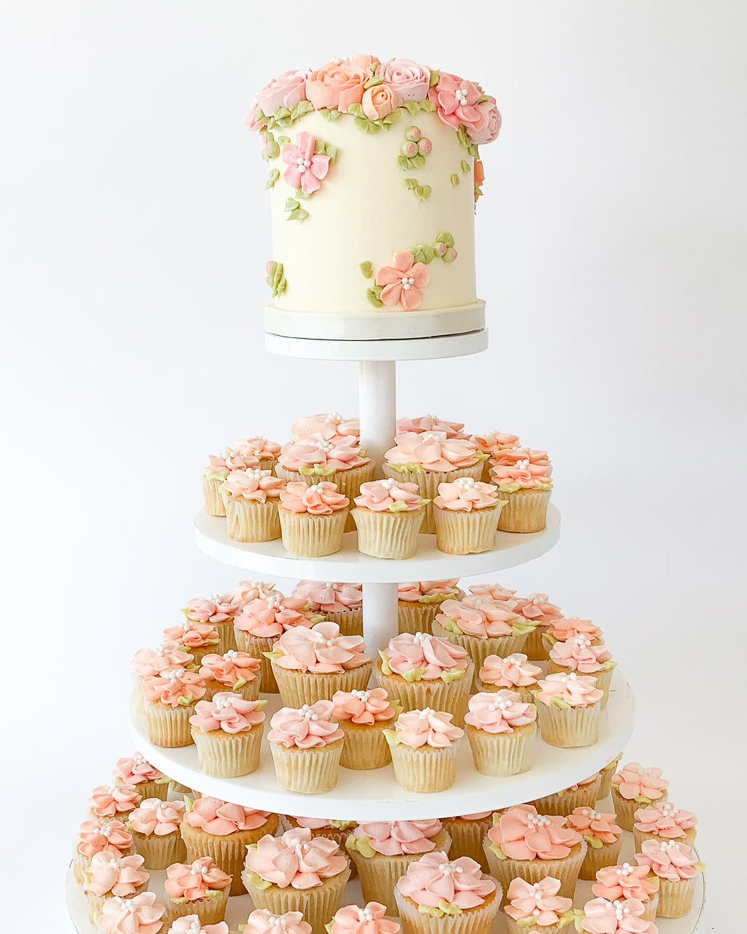 Garden in Bloom cupcake tower with piped buttercream flowers for a wedding or event