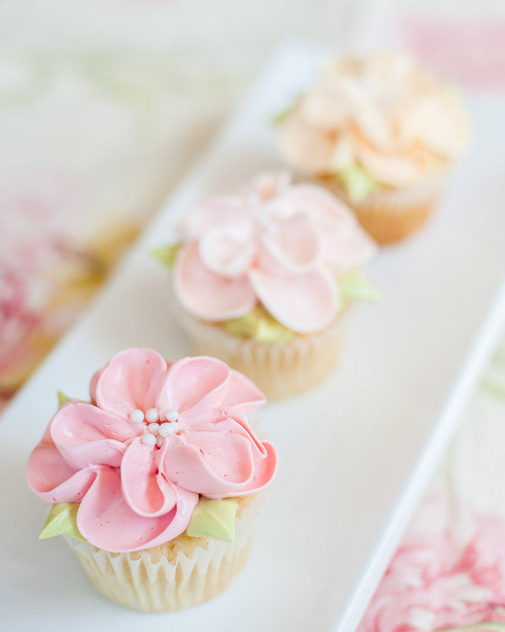 Garden in Bloom cupcakes with piped buttercream flowers, by Bobbette & Belle