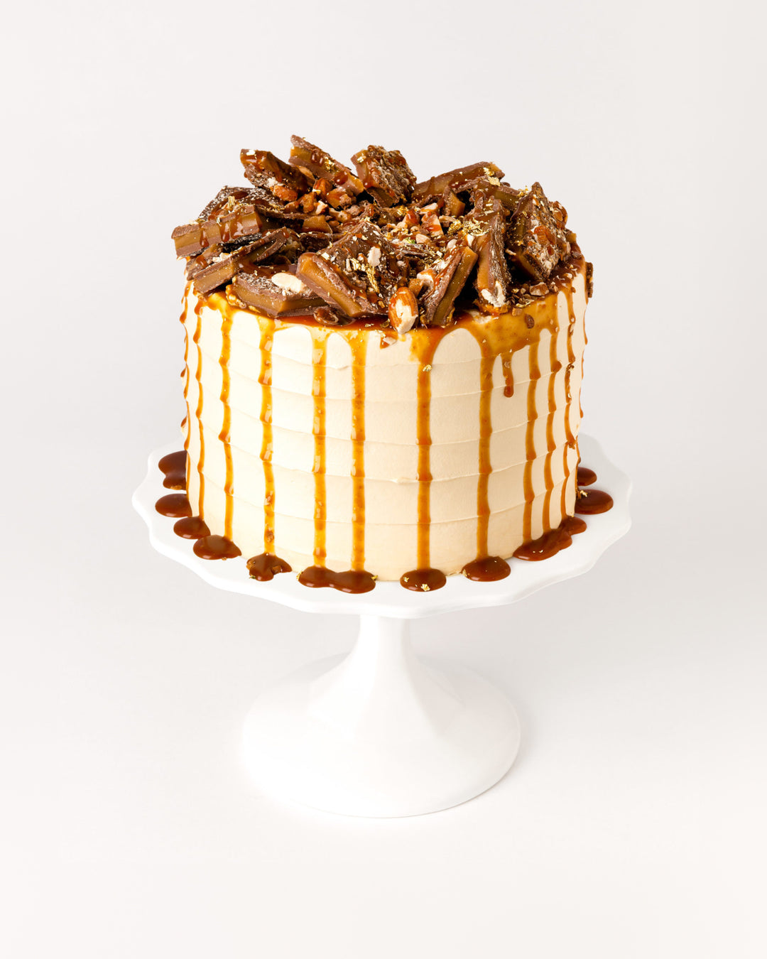 Salted caramel cake with toffee pieces and caramel drizzle, by Bobbette & Belle