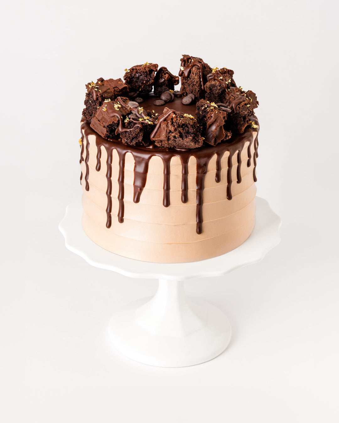 Ultimate chocolate cake with ganache drip and homemade brownie chunks