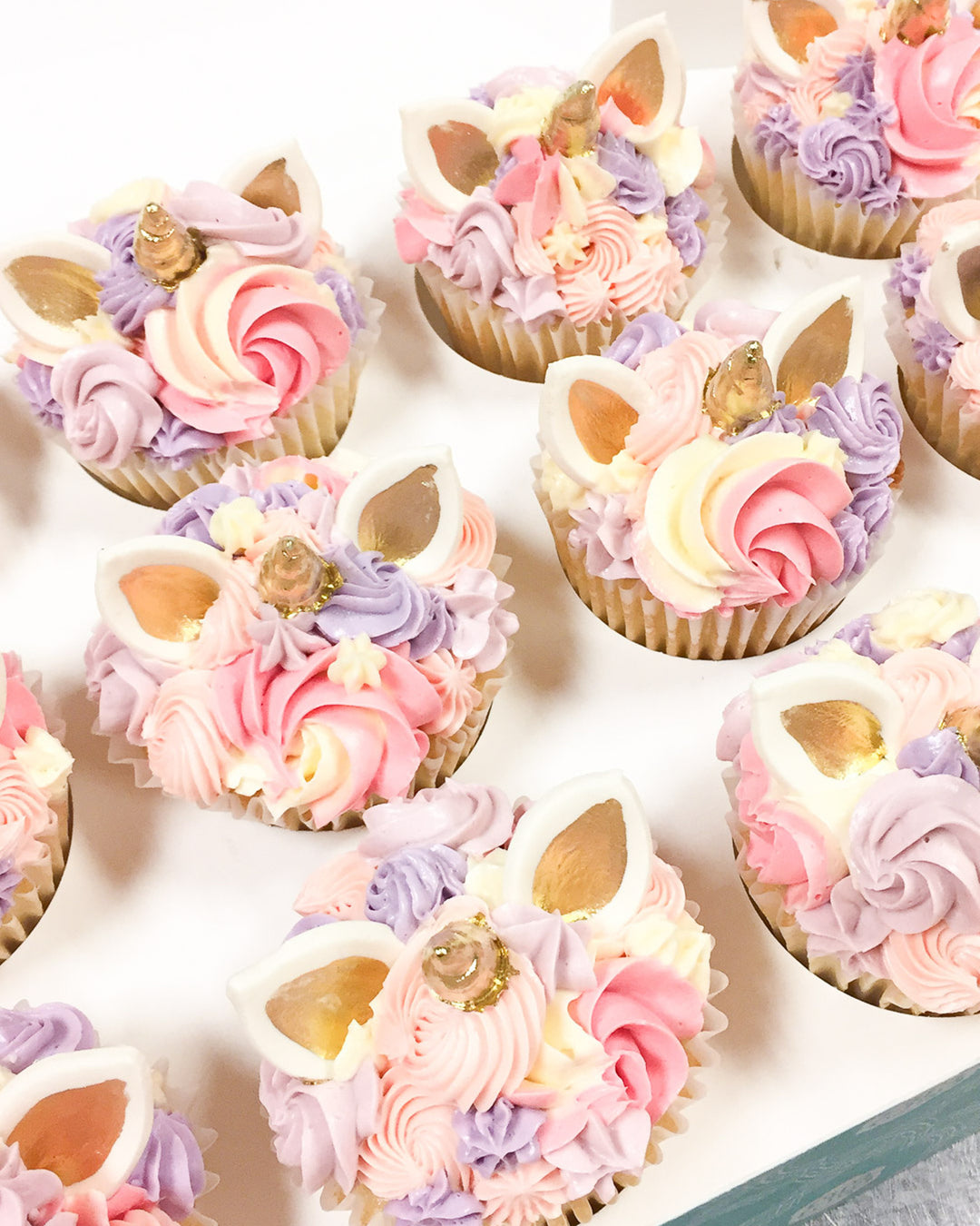 Unicorn Cupcake Favour by Bobbette & Belle, a decorated unicorn cupcake for parties
