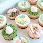 Easter cupcake gift box with assorted pastel cupcakes including bunny, floral, and nest designs