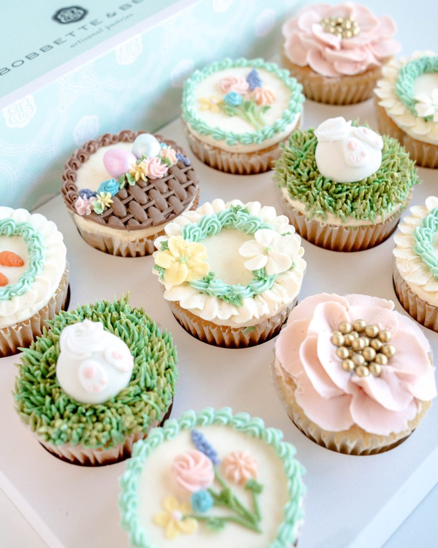 Easter cupcake gift box with assorted pastel cupcakes including bunny, floral, and nest designs