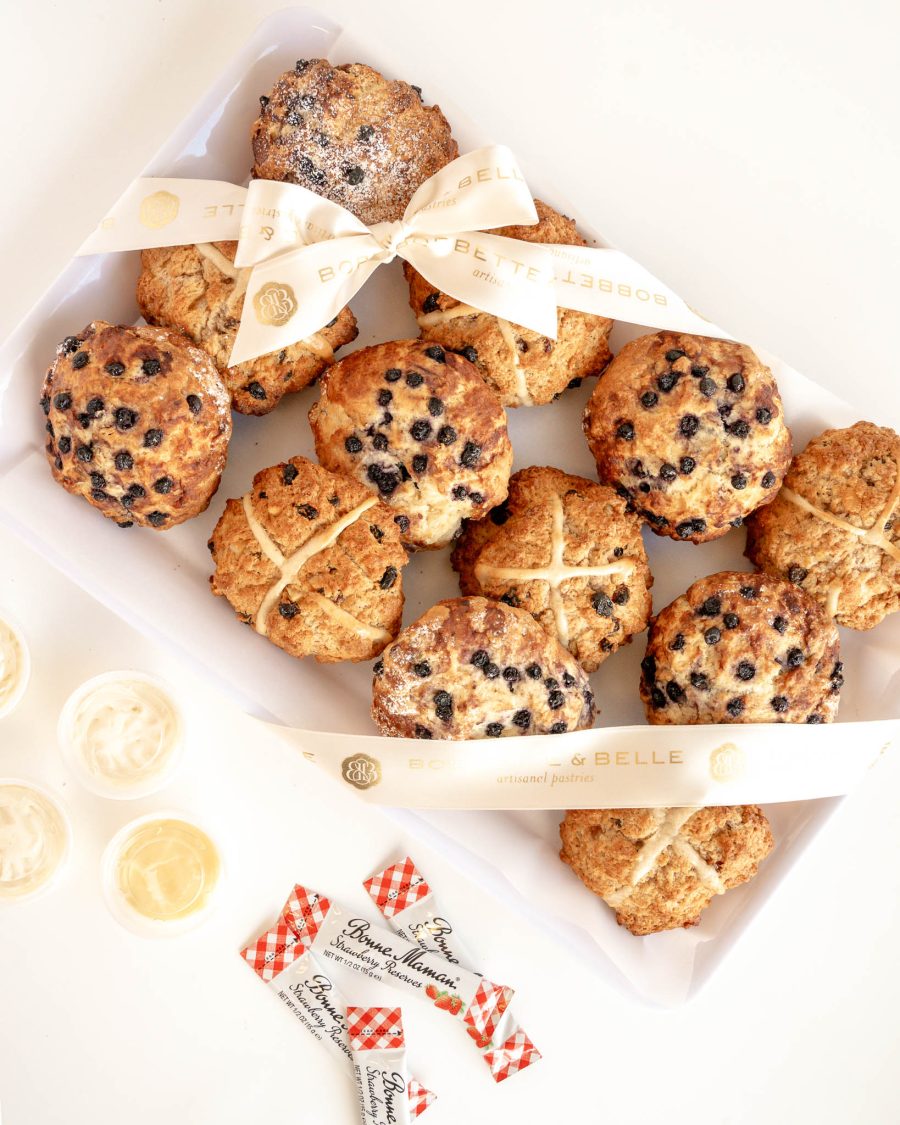 mixed scone tray with hot cross scones and blueberry scones served with cream lemon curd and jam