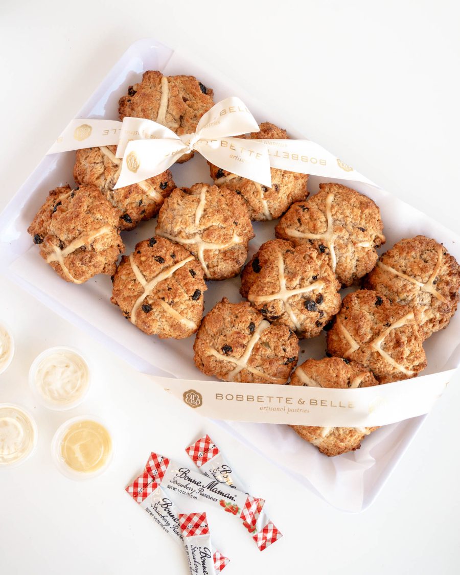 tray of hot cross scones with crosses served with devonshire cream lemon curd and jam