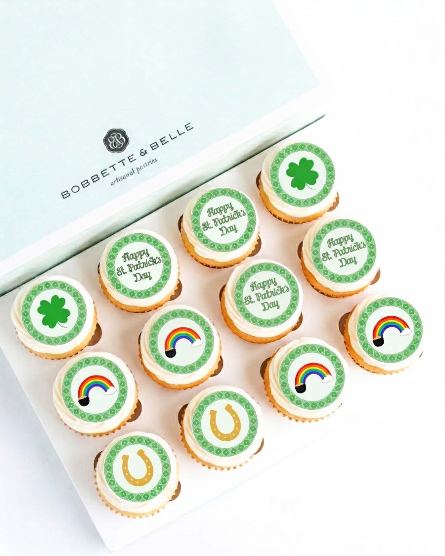 Box of St. Patrick’s Day cupcakes with shamrock, rainbow, and horseshoe edible image toppers